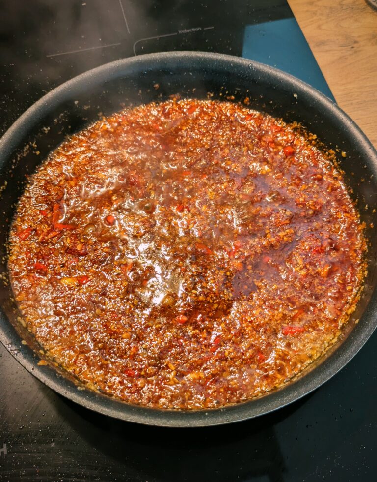 Garlic, shallots, ginger, fresh chilies sizzling in vegetable oil, making Nepali-style saucy chili oil, chili oil recipe, my chilli oil recipe, chili sauce, food recipes, chili garlic sauce, Saru's not sos secret diary, saru's diary , Homemade Saucy Chili Oil Recipe (Better Than Store-Bought!)