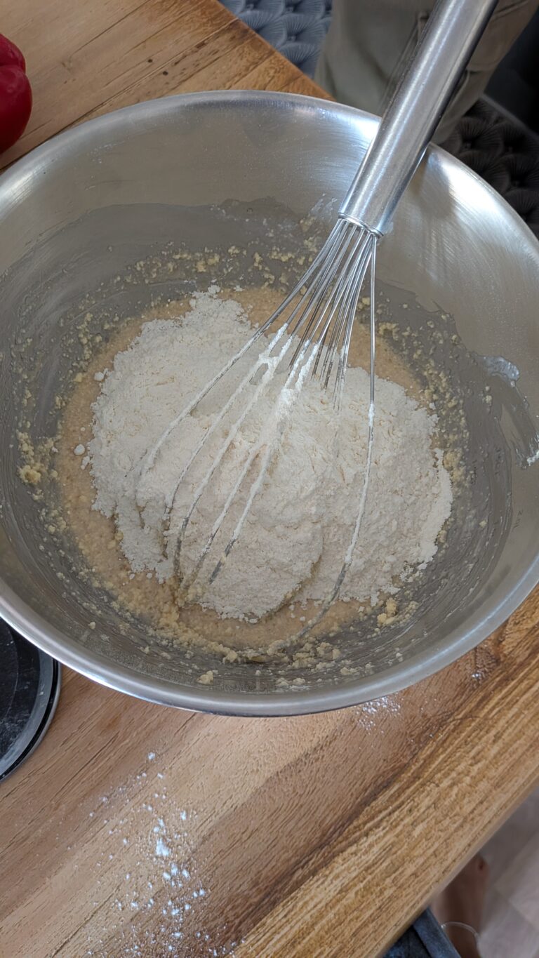 Blueberry Muffins Recipe – Method 2: Made with Butter, Freshly baked blueberry muffins made with butter, golden tops, juicy blueberries bursting inside, tender and fluffy crumb, muffins cooling on a wire rack, home-baked breakfast treat, natural light, food blog, muffin ideas, muffin recipes, blueberries recipes, baking with blueberries, baking recipes, easy muffin recipes, saru's diary, saru's not so secret diary