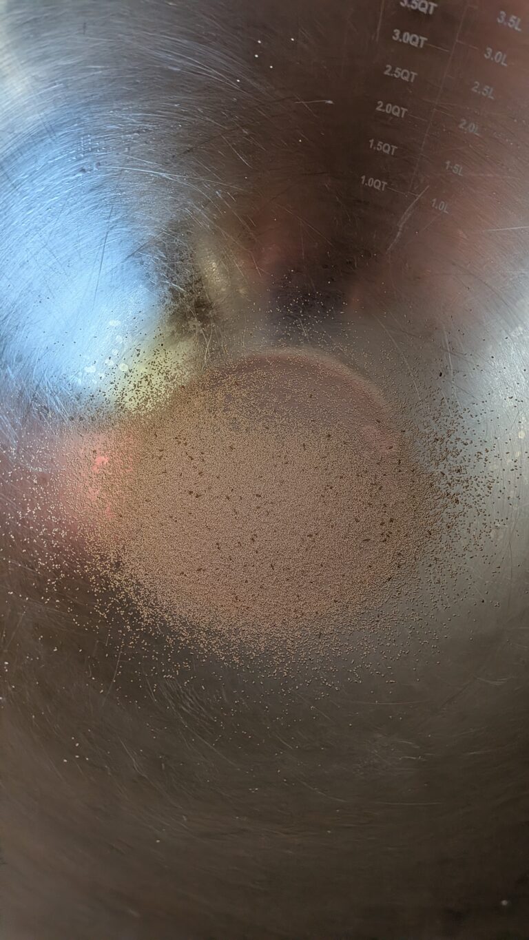 My No-Knead Artisan Bread With Black Sesame & Walnuts, Rustic no-knead black sesame bread on parchment paper, topped with poppy seeds and roasted sesame seeds, golden crust, airy texture, warm kitchen background, bread recipe, saru's diary, saru's not so secret diary, bread baking at home, homemade bread recipe