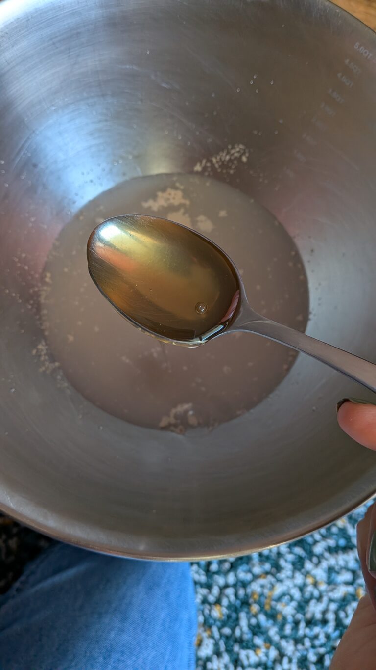 My No-Knead Artisan Bread With Black Sesame & Walnuts, Rustic no-knead black sesame bread on parchment paper, topped with poppy seeds and roasted sesame seeds, golden crust, airy texture, warm kitchen background, bread recipe, saru's diary, saru's not so secret diary, bread baking at home, homemade bread recipe