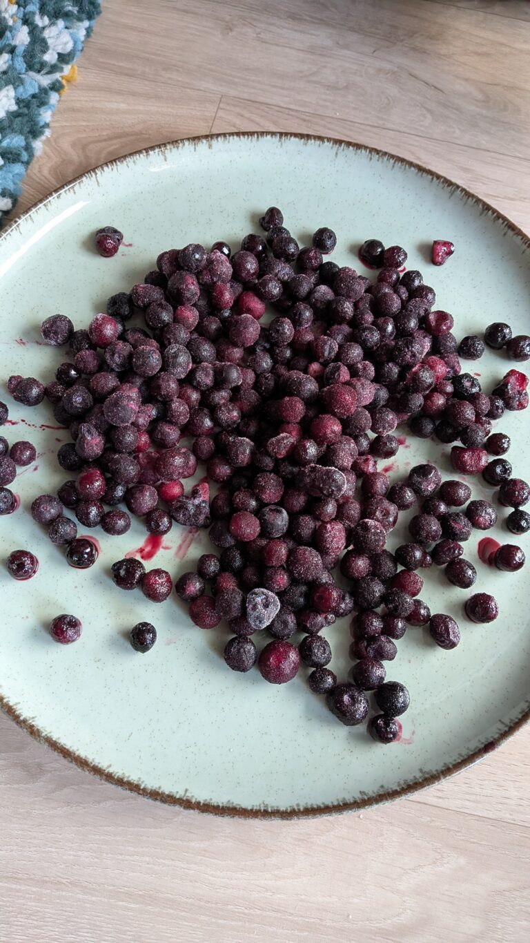 Blueberry Muffins Recipe – Method 1: Made with Oil, Freshly baked blueberry muffins made with oil, golden tops, vibrant bursts of blueberries, soft fluffy texture, muffins cooling on a rack, natural light, home-baked breakfast treat, saru's diary, saru's not so secret diary, easy muffin recipes, muffins, blueberries recipe, food recipes, dessert recipes, baking recipes