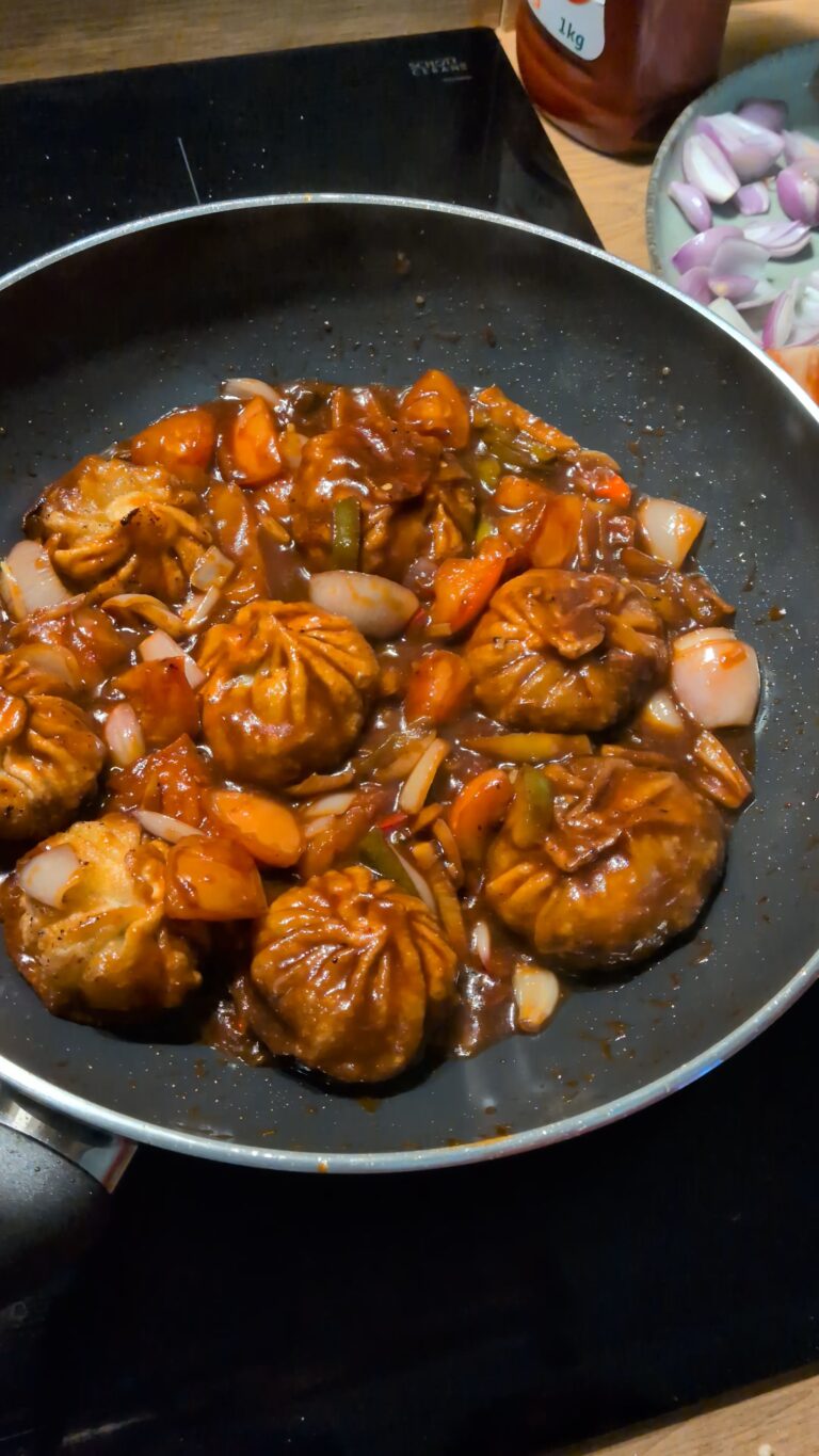 Nepali Chilli Fried Momo (Kathmandu-Style C Momo), Kathmandu-style chilli fried momo served hot with golden fried momo tossed in spicy tomato soy sauce, bell peppers, onions, fresh chillies, and garnished with cilantro and scallions, saru's diary, saru's not so secret diary, nepali food ideas, nepali food recipes, nepali, nepali food blog, food blog, authentic nepali food